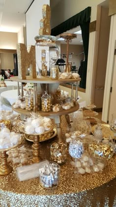 a table topped with lots of gold and white items