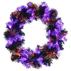 a purple wreath with orange and black tinsels on the front, against a white background