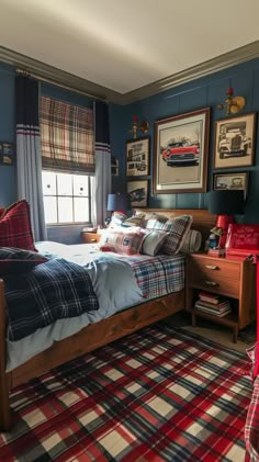 a bedroom with blue walls and plaid bedding