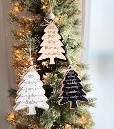 three wooden christmas trees hanging from a tree