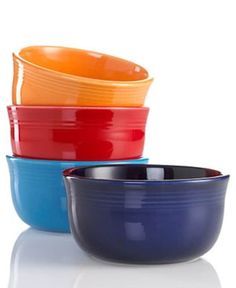 four different colored bowls stacked on top of each other