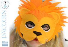 a girl wearing a yellow lion mask with long blonde hair and big eyes, looking at the camera