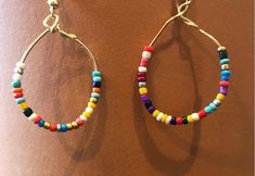 super cute hoop earring with rainbow small beads Trendy Rainbow Hoop Jewelry, Colorful Circular Jewelry As Gift, Multicolor Bohemian Hoop Jewelry, Bohemian Multicolor Hoop Jewelry, Colorful Beads Small Hoop Earrings, Trendy Rainbow Round Bead Jewelry, Colorful Beads Small Hoop Earrings As A Gift, Trendy Rainbow Round Beads Jewelry, Colorful Beads Small Hoop Earrings For Gift