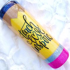 a yellow cup with writing on it sitting on a white surface next to the words campfire crafting company