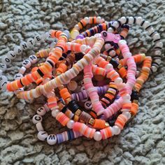 13 halloween clay bead bracelets! They're perfect for small gifts,boo baskets and to even hand out the jackolantern one glows in the dark Preppy Halloween, Clay Bead Bracelets, Boo Baskets, Colorful Bead Bracelets, Halloween Clay, Autumn Bracelet, Halloween Autumn