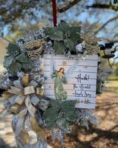 a christmas wreath with an angel on it