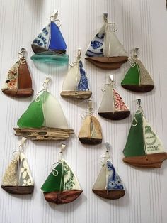 a group of small sail boats sitting on top of a table