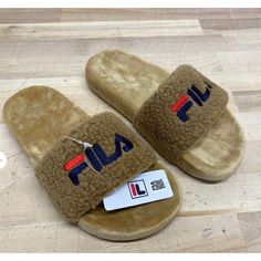 I Offer Combined Or Bundle Shipping. Please Visit My Store For More Items. Brand New With Tag & Box. Message Me For Any Questions. Comes From Smoke-Free And Pet-Free Home. Elevate Your Casual Look With These Fila Women's Fuzzy Drifter Slide Sandals. The Slip-On Design And Synthetic Rubber Sole Make Them Perfect For A Day Out Running Errands Or Relaxing At Home. The Faux Fur Lining And Suede Insole Provide Comfort And Warmth, Making Them Ideal For The Summer, Fall, And Spring Seasons. These Sandals Feature A Solid Pattern, Beige-Brown Color, And Fila Logo Accents. The 1-Inch Flat Heel Style And Standard Shoe Width Make Them A Perfect Fit For Any Occasion. Whether You're Going For A Laid-Ba Fila Logo, Suede Slippers, Synthetic Rubber, Beige Brown, Spring Season, Solid Pattern, Brown Suede, Summer Fall, Slide Sandals