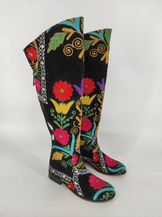 This is handembroidered genuine leather custom made over knee boots. Made with naturel leather, suzani velvet, ykk zipper. There is every size available, 6 us to 11 us, 36 eu to 43 eu. There is 1 inches 2.5 cm low heel. On boots colorful floral pattern on black suzani. Light and very comfy, waterproof. ** If you need wider calf please let us know your calf circle measurments.  ** If you like higher heel cowboy style boots please let us know. ** To make custom boots NO extra charging. Note: The pair you receive may be similar but not identical to any photos on our website. We have door to door express shipping service. If you have any questions please contact with us. bemyboots.etsy.com Thank You Boots Embroidered, Boots Colorful, Casual Leather Boots, Boots Low Heel, Embroidered Fashion, Festival Boots, Riding Boots Fashion, Over Knee Boots, Fashion Cowboy Boots