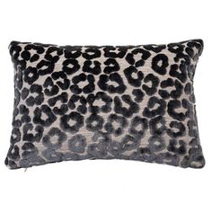 a leopard print pillow on a white background