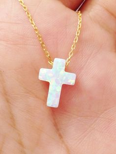 Synthetic White Opal Cross pendant, comes with a 925 Sterling Silver necklace, Yellow gold plated, Rose gold plated. Notice that this necklace comes with extender to adjust to different lengths. Chain total length : 39.5 cm / 15.5 inches not included extender. Extender length : 2.5 cm / 1 inche approximately Cross size: 12mm x 9mm Spring clasp Our jewelry is packaged in a beautiful gift box. If you need a necklace as a gift, we can ship to third party. During check out, please leave a note in th White Clavicle Chain Cross Jewelry, White Cross Collar Necklace, White 14k Gold Cross Necklace Gift, White 14k Gold Cross Necklace As Gift, 14k Gold White Cross Necklace As Gift, Tarnish Resistant White Necklace For Gift, White Tarnish Resistant Necklace For Gift, Spiritual White Clavicle Chain Jewelry, Spiritual White Clavicle Chain Necklace