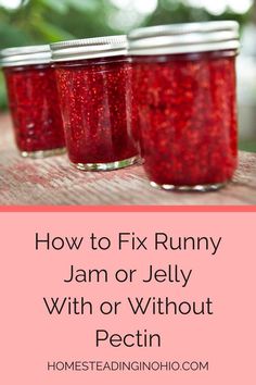 three jars filled with jam on top of a wooden table