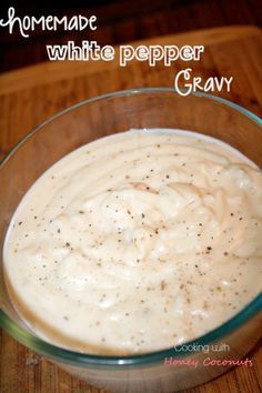 homemade white pepper gravy in a glass bowl on a wooden table with text overlay