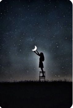 a person standing on a ladder reaching up to the sky at night with stars in the background