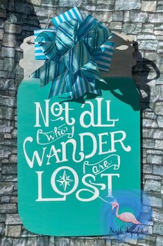 a sign that says not all who wander are lost