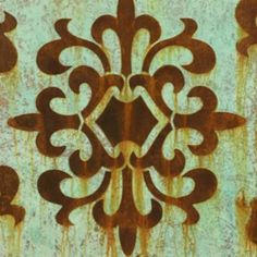 an old rusted metal plate with designs on it