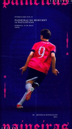 a young boy kicking a soccer ball on top of a blue field with pink stars