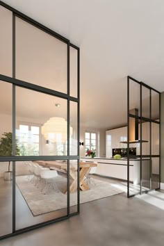 an image of a living room with glass doors on the wall and windows in the floor