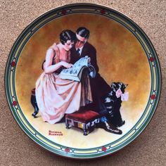 a plate with a painting of two people and a dog sitting on top of it