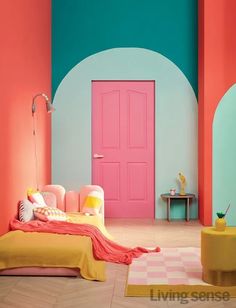 a bedroom with pink, yellow and blue walls in the room is decorated like an arch