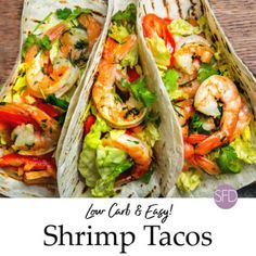 three shrimp tacos with lettuce and tomatoes