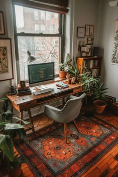 a home office with plants and pictures on the wall