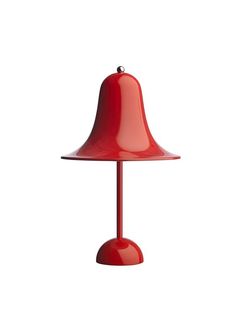 a red table lamp on a white background