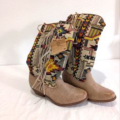 Faux Leather Boots In A Beige Color With Southwestern Print Fabric Shaft. 1.5" Block Heel, Almond Shaped Toe And Fringed Zipper. Really Cute Boots! I Don't Believe These Have Been Worn! There Are Some Tags Attached To The Zippers And Soles Are Unworn. There Is Some Cracking On The Inside At The Top Of The Shaft, Possibly From Storage. Aside From That The Boots Are In Fabulous Condition! Size 7.5 Southwestern Print, Ethiopian Opal Ring, Big Buddha, Faux Leather Boots, Almond Shaped, Cute Boots, Print Fabric, Western Boots, Beige Color