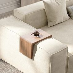 a couch with a wooden table on top of it