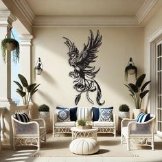 a living room filled with white furniture and walls covered in black birds on the wall