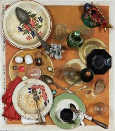 an assortment of dishes and utensils on a table