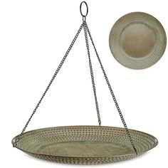 a metal hanging basket with two plates on the side and one plate attached to it