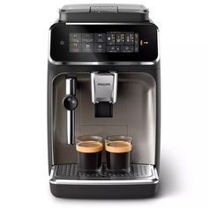 an espresso machine with two glasses on the front and one is black in color