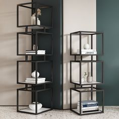 a book shelf with books and vases on it in front of a green wall