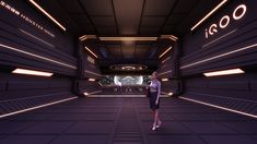 a woman is walking through a futuristic space station