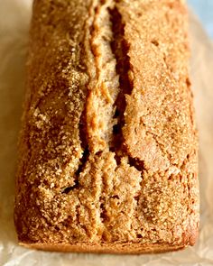 a loaf of bread sitting on top of wax paper