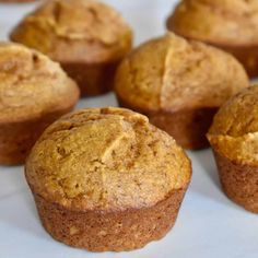 several muffins sitting on top of a white table