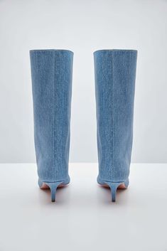 For Spring/Summer 2024, Amina Muaddi played with the idea of trompe l'œil by crafting a pair of thigh-high suede boots with a denim print. Spring Denim Knee-high Boots, Spring Knee-high Denim Boots, Denim Knee-high Boots For Spring, Denim Summer Boots, Fitted Denim Summer Boots, Fitted Denim Boots For Summer, Fitted Denim Knee-high Boots, Fitted Denim Boots For Spring, Blue Fitted Knee-high Boots For Spring