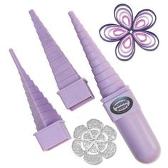 purple plastic candy making tools with flower design on the top and two cutters next to it