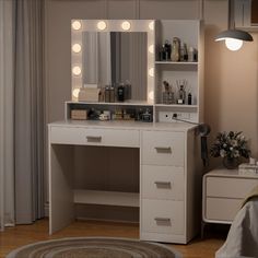 a white vanity with lights on it in a bedroom