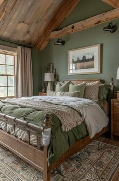 a large bed sitting under a wooden ceiling in a bedroom next to a window with curtains