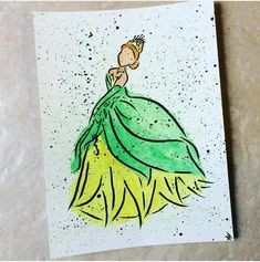 a drawing of a woman in a green dress on a piece of paper with watercolor paint