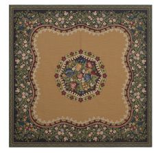 a large rug with flowers and leaves on the center, in gold color scheme that has green border around it