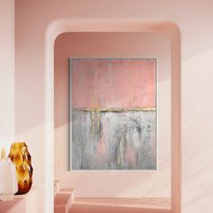 an abstract painting hangs on the wall next to two vases and a lamp in a pink room