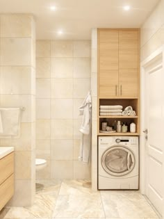 a washer and dryer in a bathroom with white tile flooring on the walls