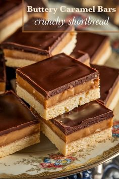 chocolate and peanut butter caramel bars are stacked on top of each other with the words, crunchy shortbread