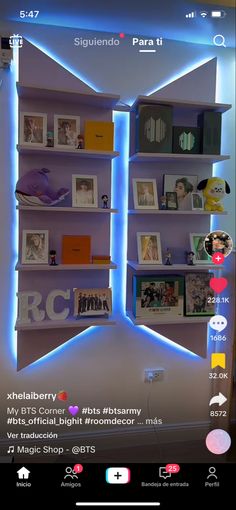 an image of a room with bookshelves and pictures on the shelves that are lit up