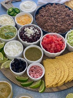 a platter filled with tortillas, salsa and other condiments