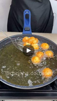 some food is being cooked in a frying pan on top of a stovetop