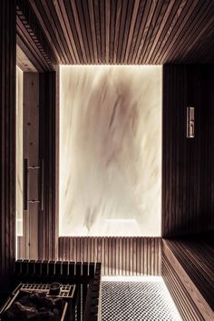 the inside of a sauna with wooden walls and flooring